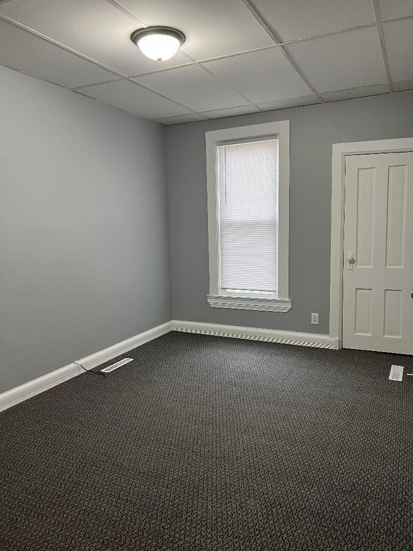 343 South Harrison Avenue, Unit 343 Kankakee, IL 60901 - Photo 5 of 5 an empty room with a window