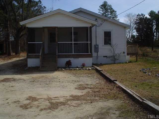 213 New Rand Road Garner, NC 27529 - Photo 1 of 3 a front view of a house with a yard