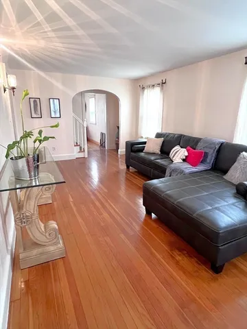 a spacious bedroom with a bed and a window