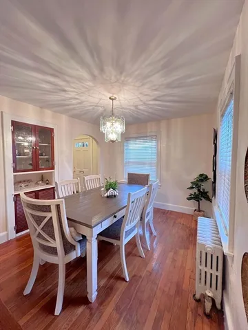 a view of a room with wooden floor and air conditioner