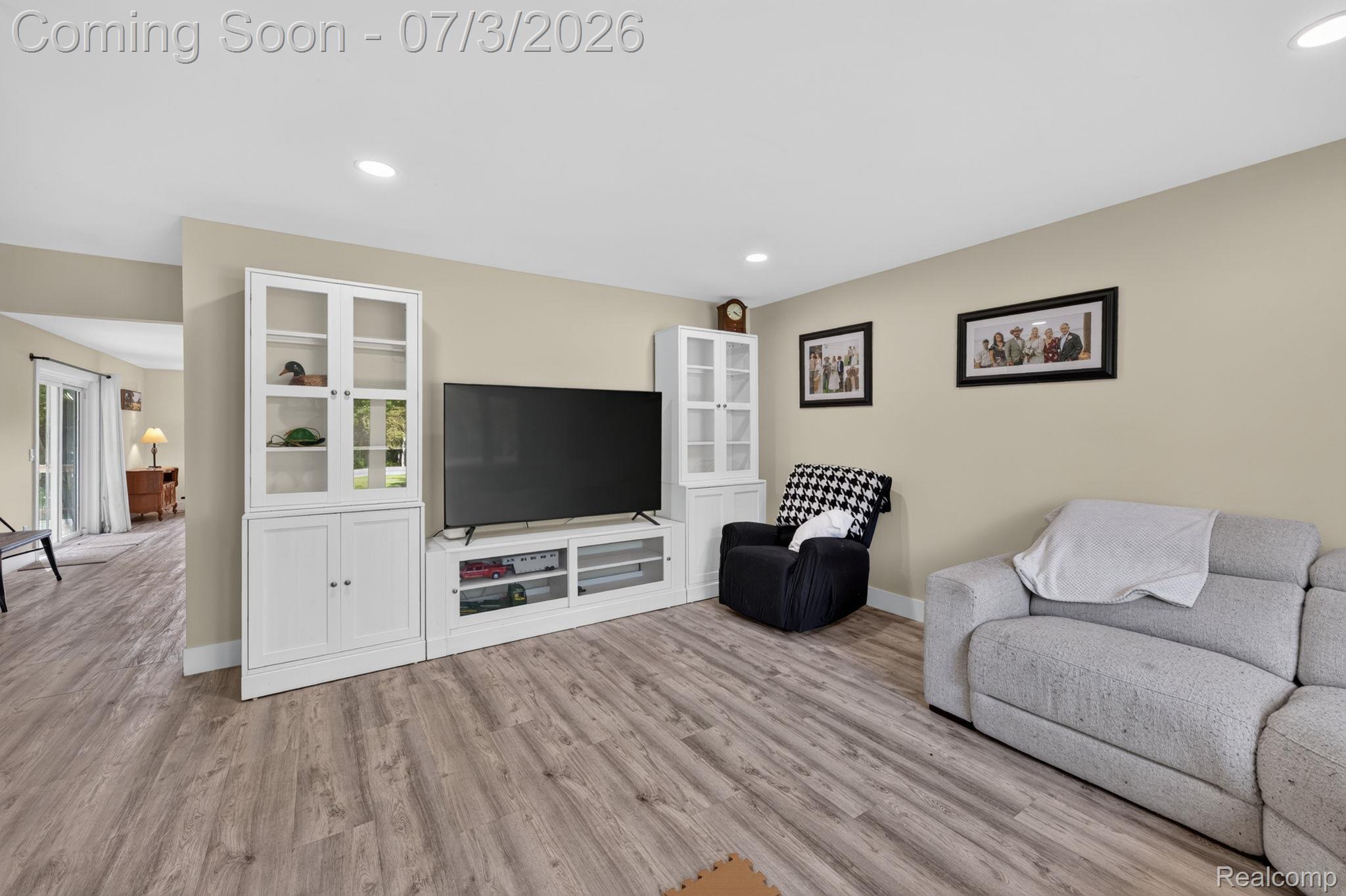 5355 North Seymour Road Flushing, MI 48433 - Photo 8 of 41 Spacious living area featuring wood-finish flooring, recessed lighting, and neutral wall tones