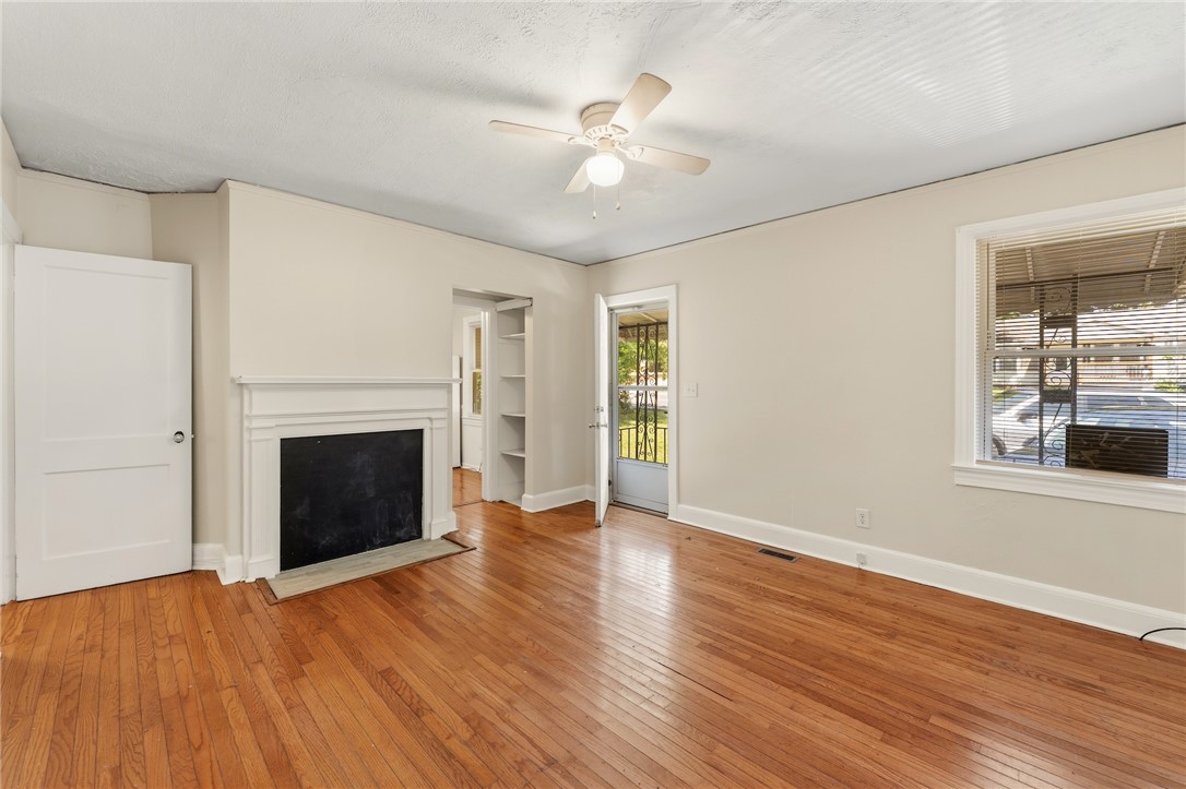 606 Perry Road Greenville, SC 29609 - Photo 6 of 22 A classic fireplace mantel anchor this inviting living space.