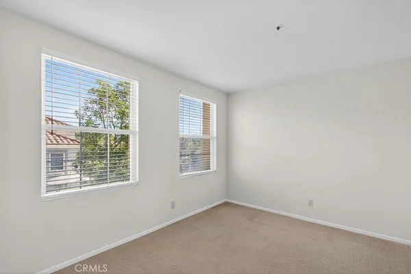 an empty room with a mirror