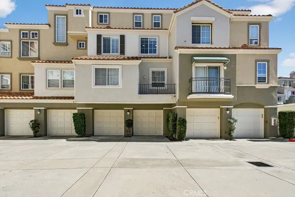 a view of a lake with couches chairs