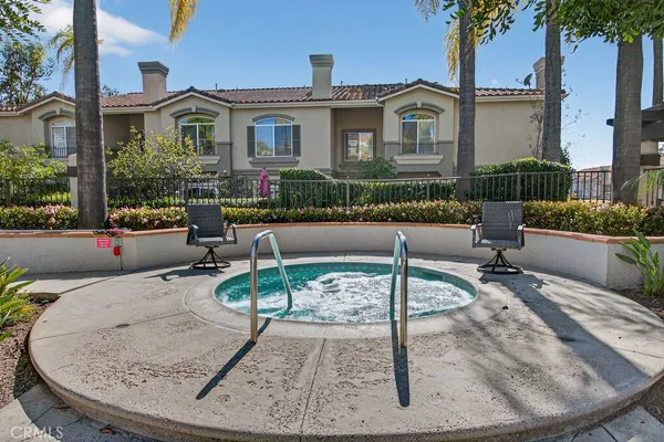 a view of a lake with houses in the back