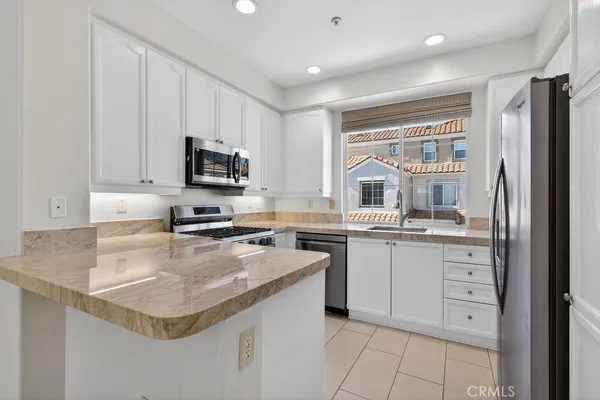 a view of empty room with a fireplace