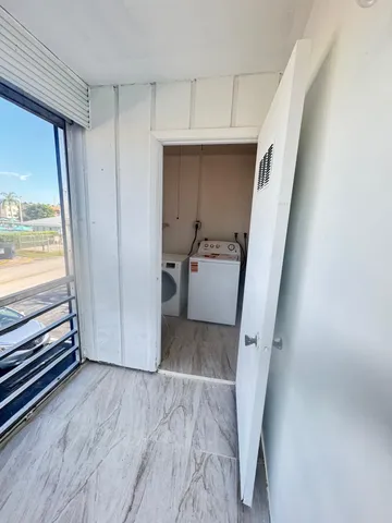 a view of a hallway view with staircase