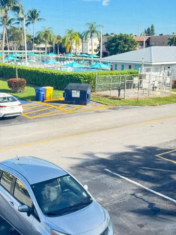a view of yard with swimming pool and outdoor seating