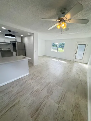 a view of a kitchen with a sink and a microwave