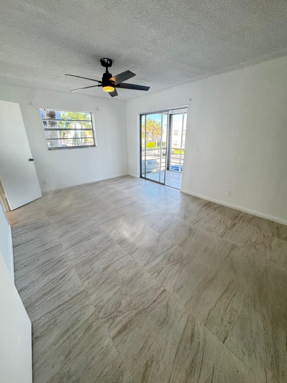 266 Burgundy Avenue, Unit 266 Delray Beach, FL 33484 - Photo 9 of 14 a view of an empty room with a window