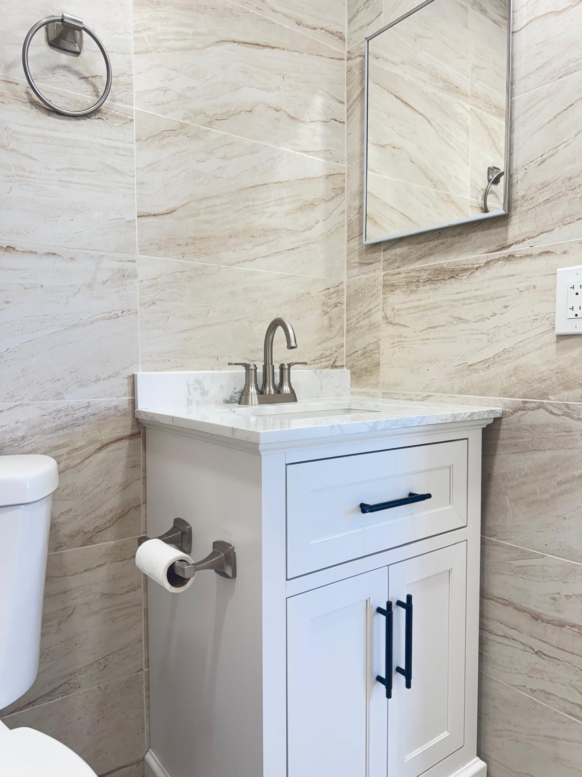 266 Burgundy Avenue, Unit 266 Delray Beach, FL 33484 - Photo 10 of 14 a bathroom with a sink toilet and mirror