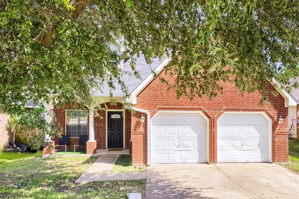 1214 South Beltline Road Dallas, TX 75253 - Photo 1 of 8 Traditional brick exterior with an attached two-car garage