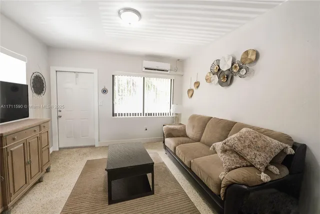 a kitchen with stainless steel appliances a refrigerator and a stove top oven