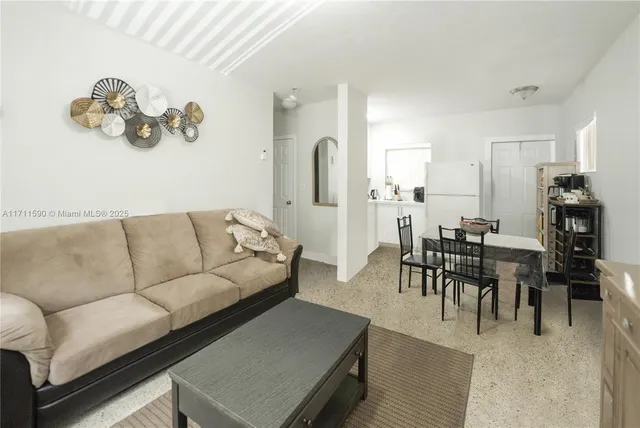 a livingroom with furniture flat screen tv and outdoor view