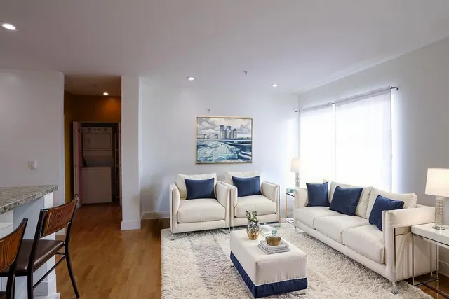 a living room with furniture and a couch