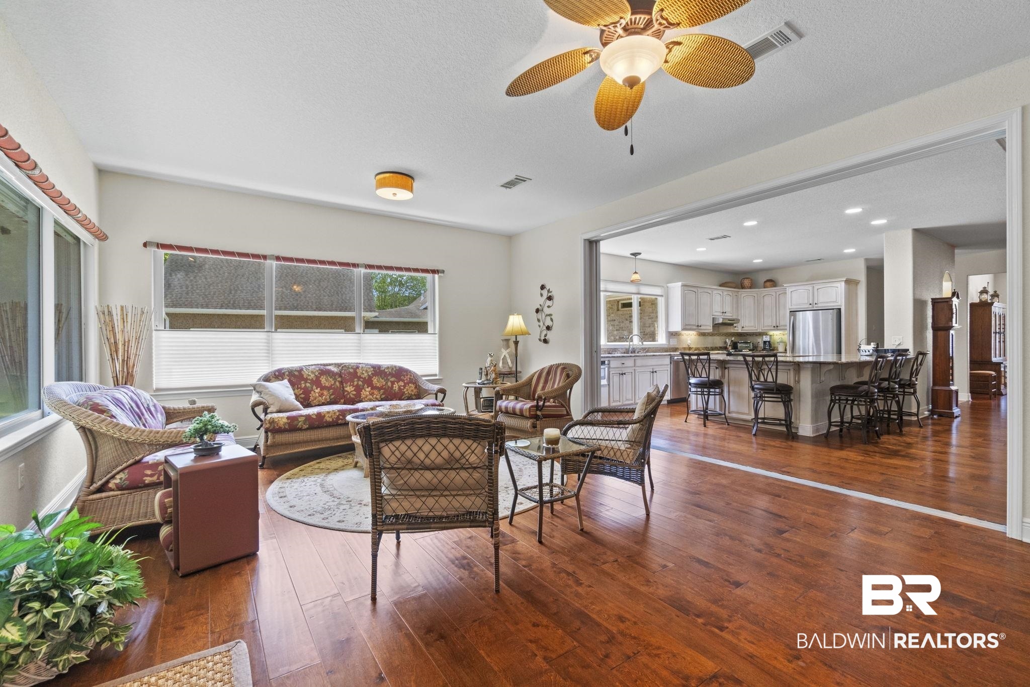 8664 Foxtail Loop Pensacola, FL 32526 - Photo 18 of 64 Living area with plenty of natural light, wood-type flooring, and ceiling fan