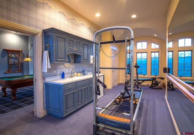 a bedroom with furniture and a wooden floor