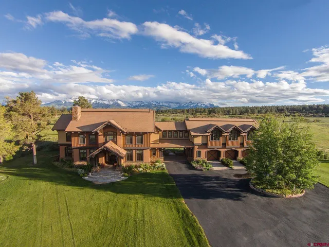 a view of a yard with an outdoor seating