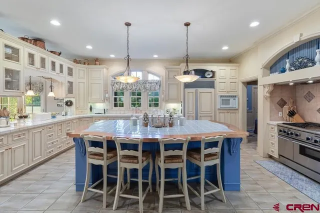 a spacious bedroom with a bed and a table