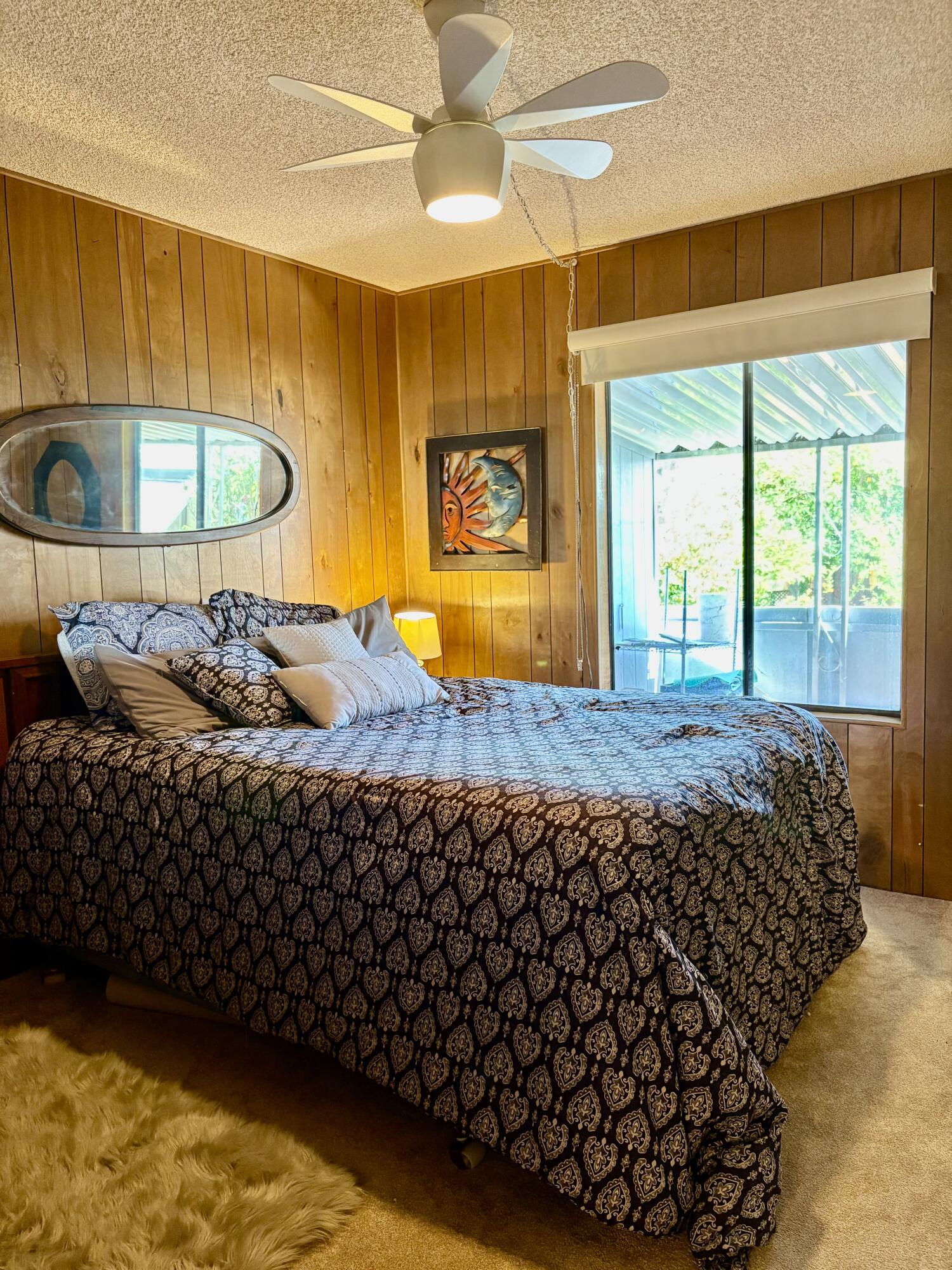 74711 Dillon Road, Unit 387 Desert Hot Springs, CA 92241 - Photo 20 of 50 a bed sitting in a bedroom next to a window