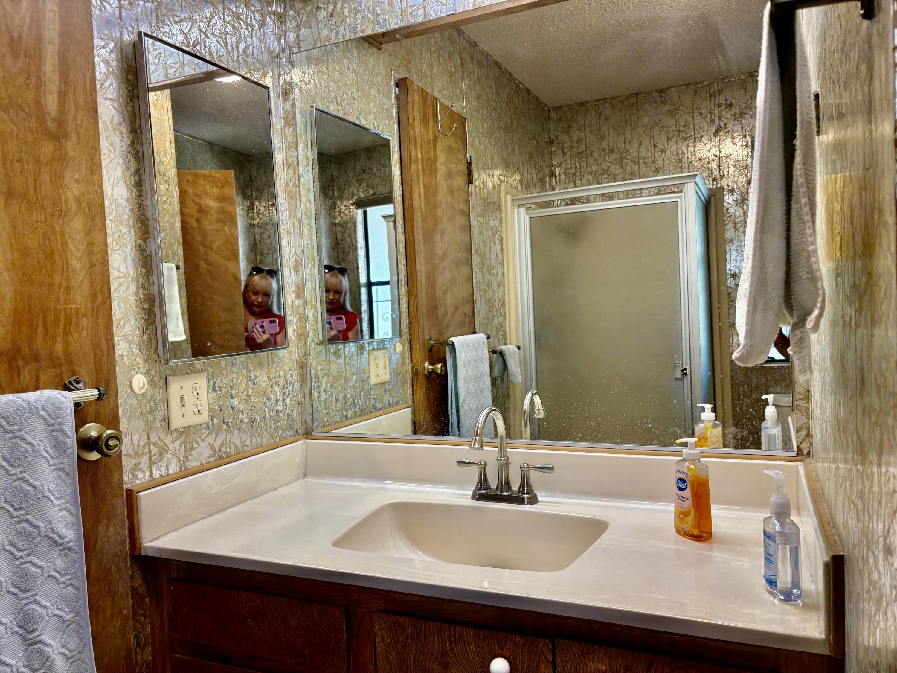 74711 Dillon Road, Unit 387 Desert Hot Springs, CA 92241 - Photo 22 of 50 a bathroom with a sink and a mirror