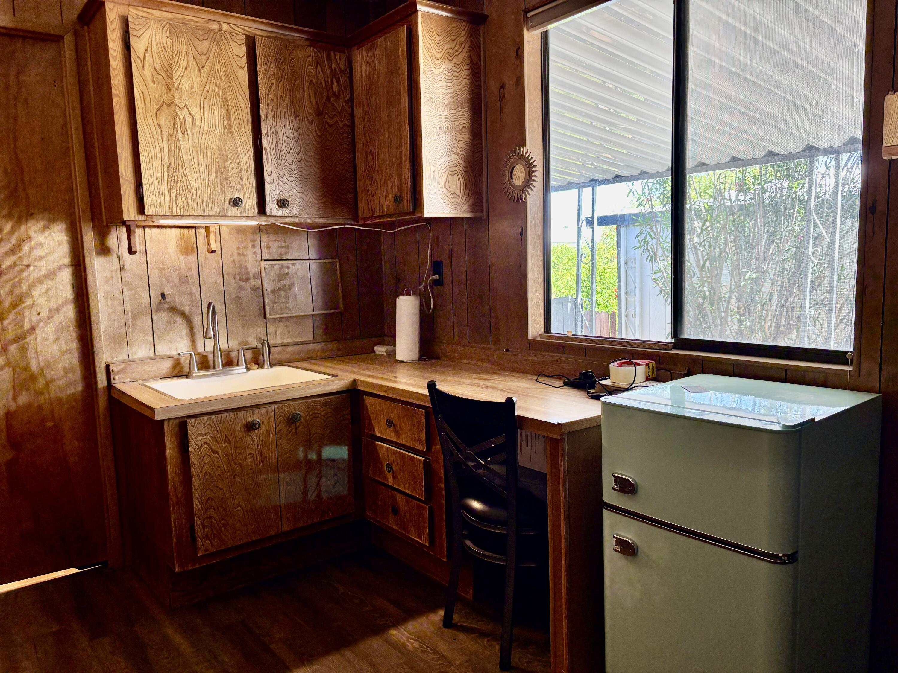 74711 Dillon Road, Unit 387 Desert Hot Springs, CA 92241 - Photo 25 of 50 a kitchen with a sink and a window