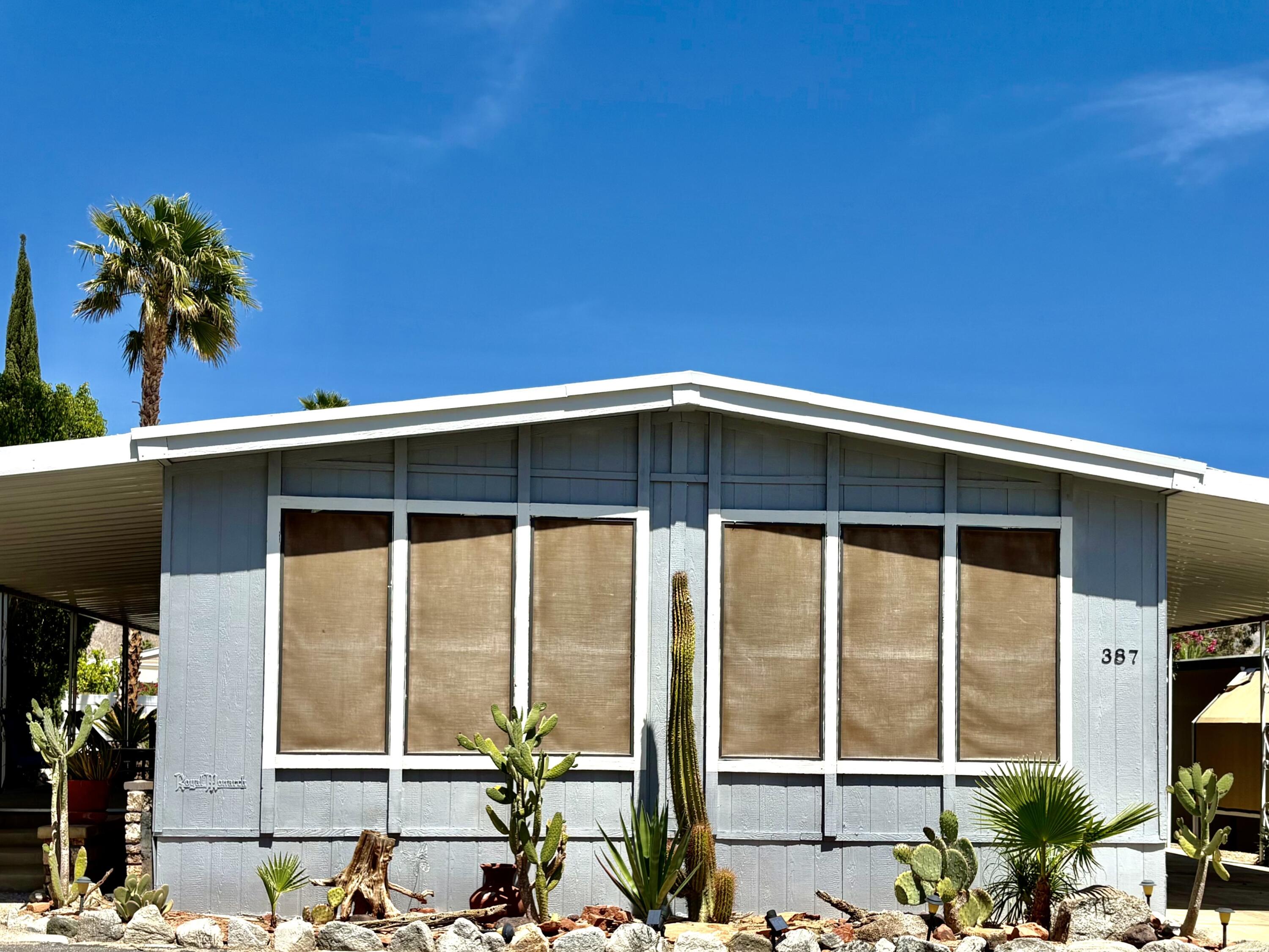 74711 Dillon Road, Unit 387 Desert Hot Springs, CA 92241 - Photo 3 of 50 a front view of a house with a window