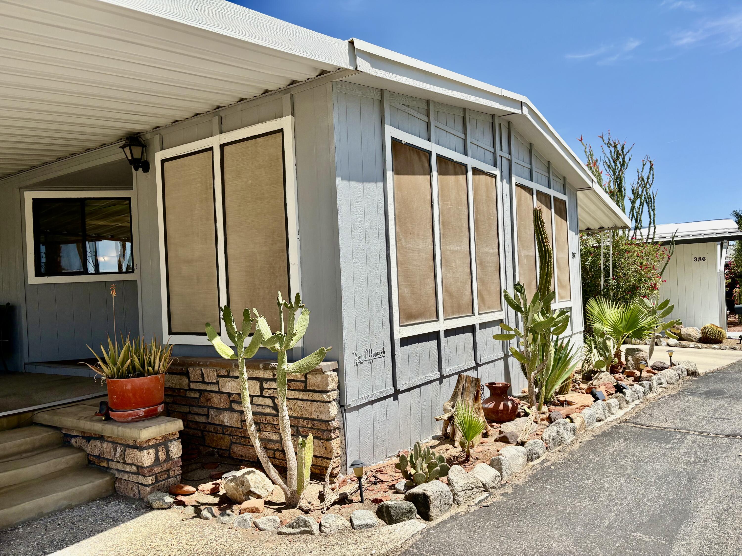 74711 Dillon Road, Unit 387 Desert Hot Springs, CA 92241 - Photo 4 of 50 a front view of a house