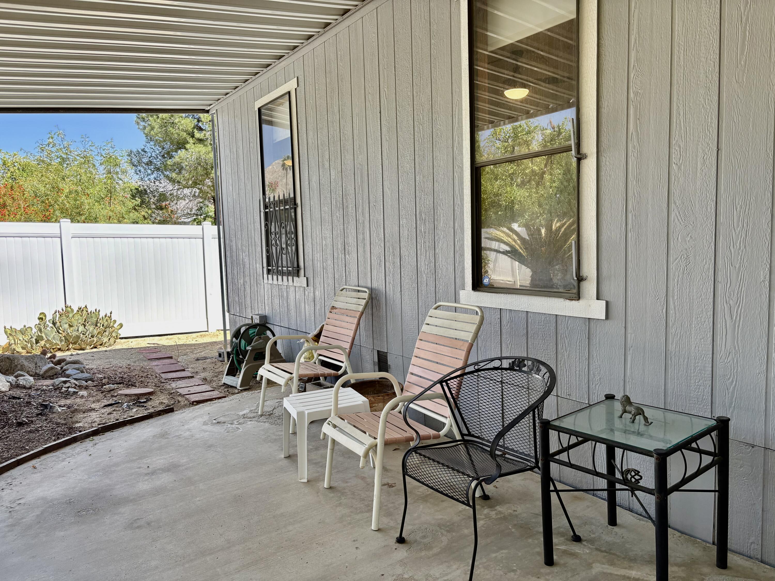 74711 Dillon Road, Unit 387 Desert Hot Springs, CA 92241 - Photo 7 of 50 a living room with furniture and a window