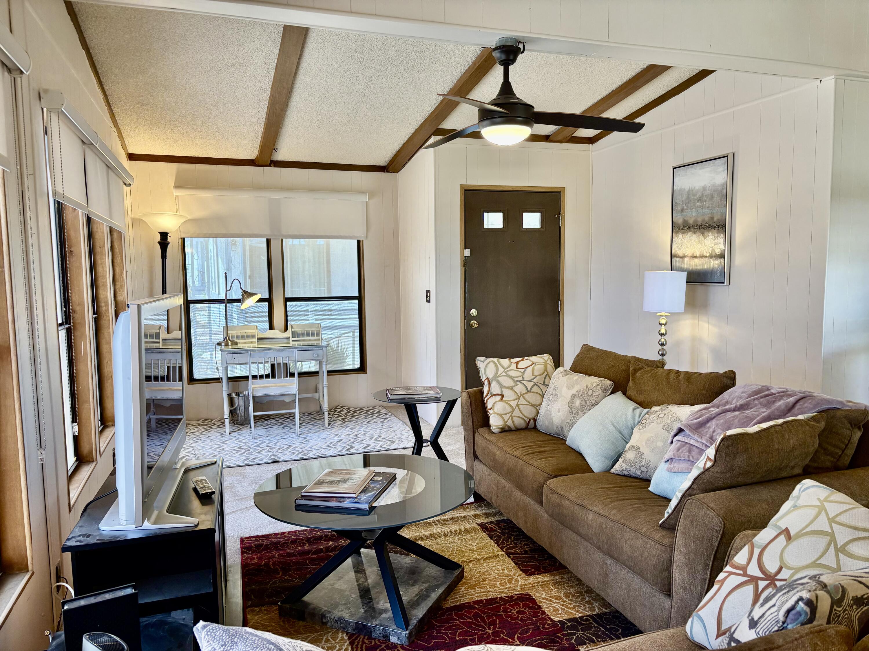 74711 Dillon Road, Unit 387 Desert Hot Springs, CA 92241 - Photo 10 of 50 a living room with furniture and a window
