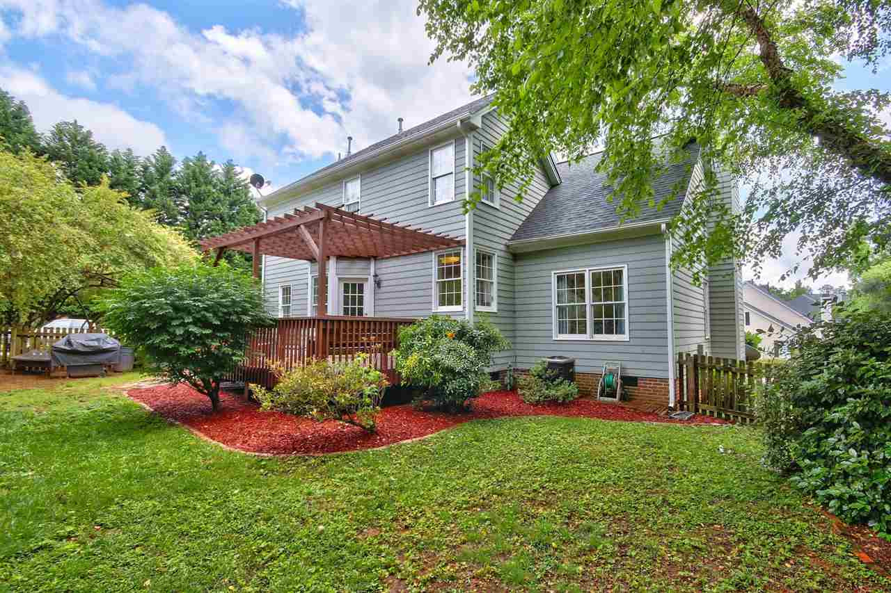 5300 Halcott Court Raleigh, NC 27613 - Photo 22 of 23 Additional view of the lovely backyard with big deck, veranda and fenced in yard. Large enough to play a game of corn hole and jump on the trampoline! Exterior Back