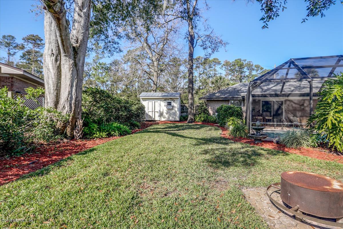 14310 Stacey Road Jacksonville, FL 32250 - Photo 17 of 20 a front view of a house with garden