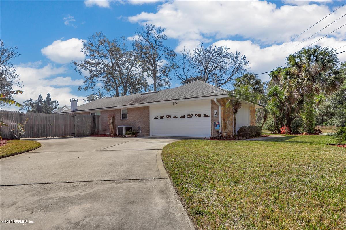 14310 Stacey Road Jacksonville, FL 32250 - Photo 20 of 20 a large house with a large tree in front of it