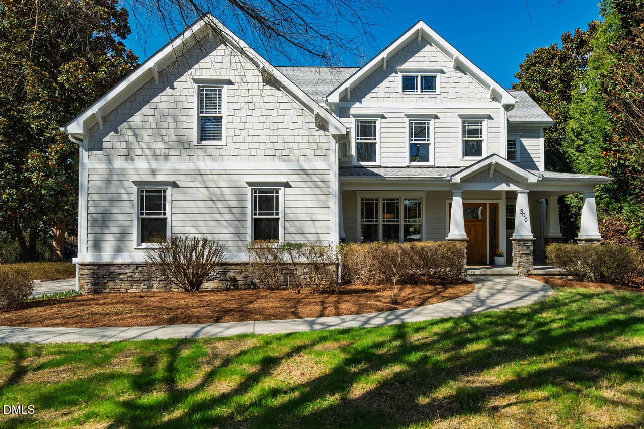 a front view of a house with yard