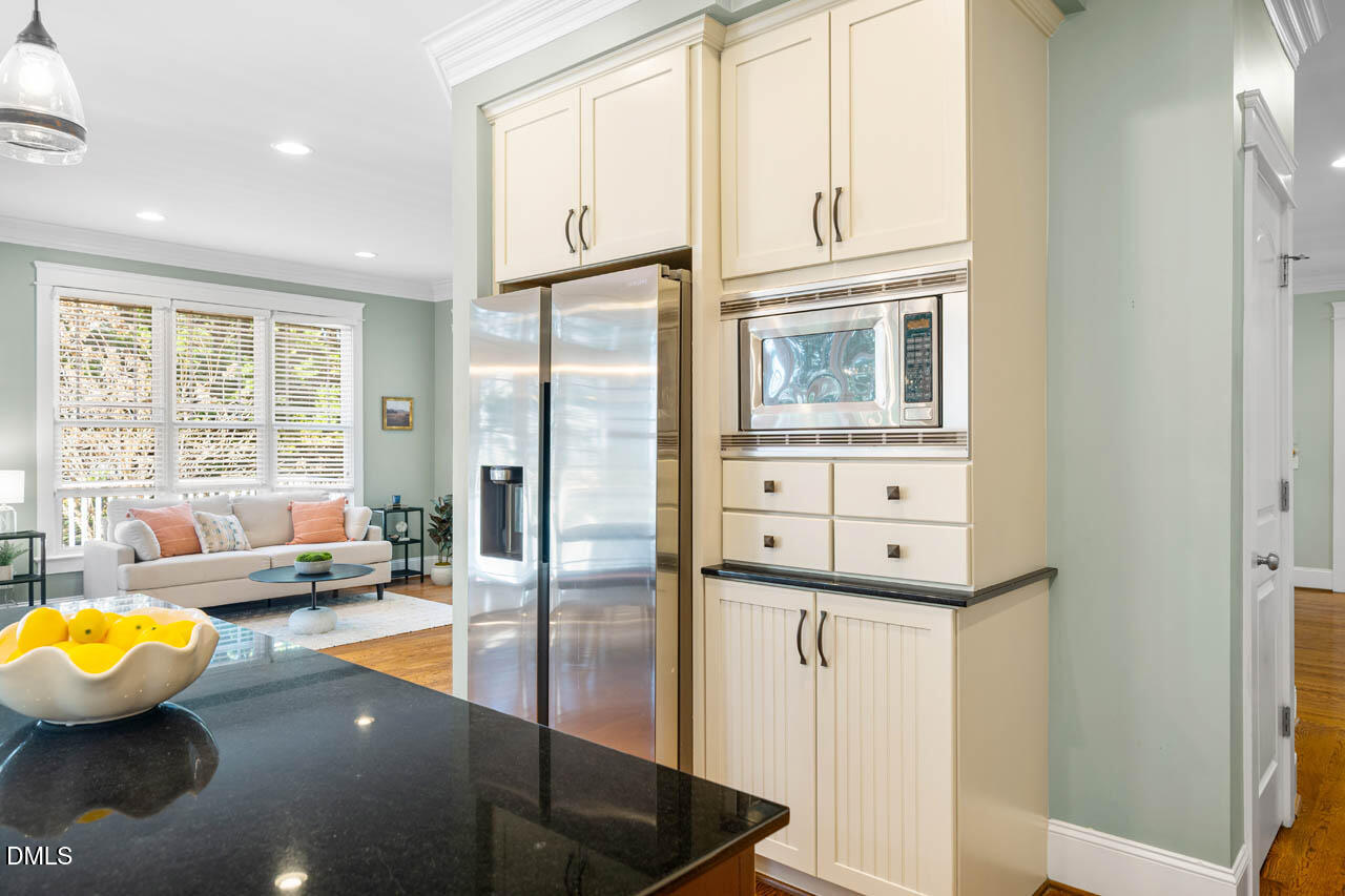 300 Long Meadows Road Chapel Hill, NC 27516 - Photo 15 of 42 a kitchen with stainless steel appliances granite countertop a refrigerator and a stove