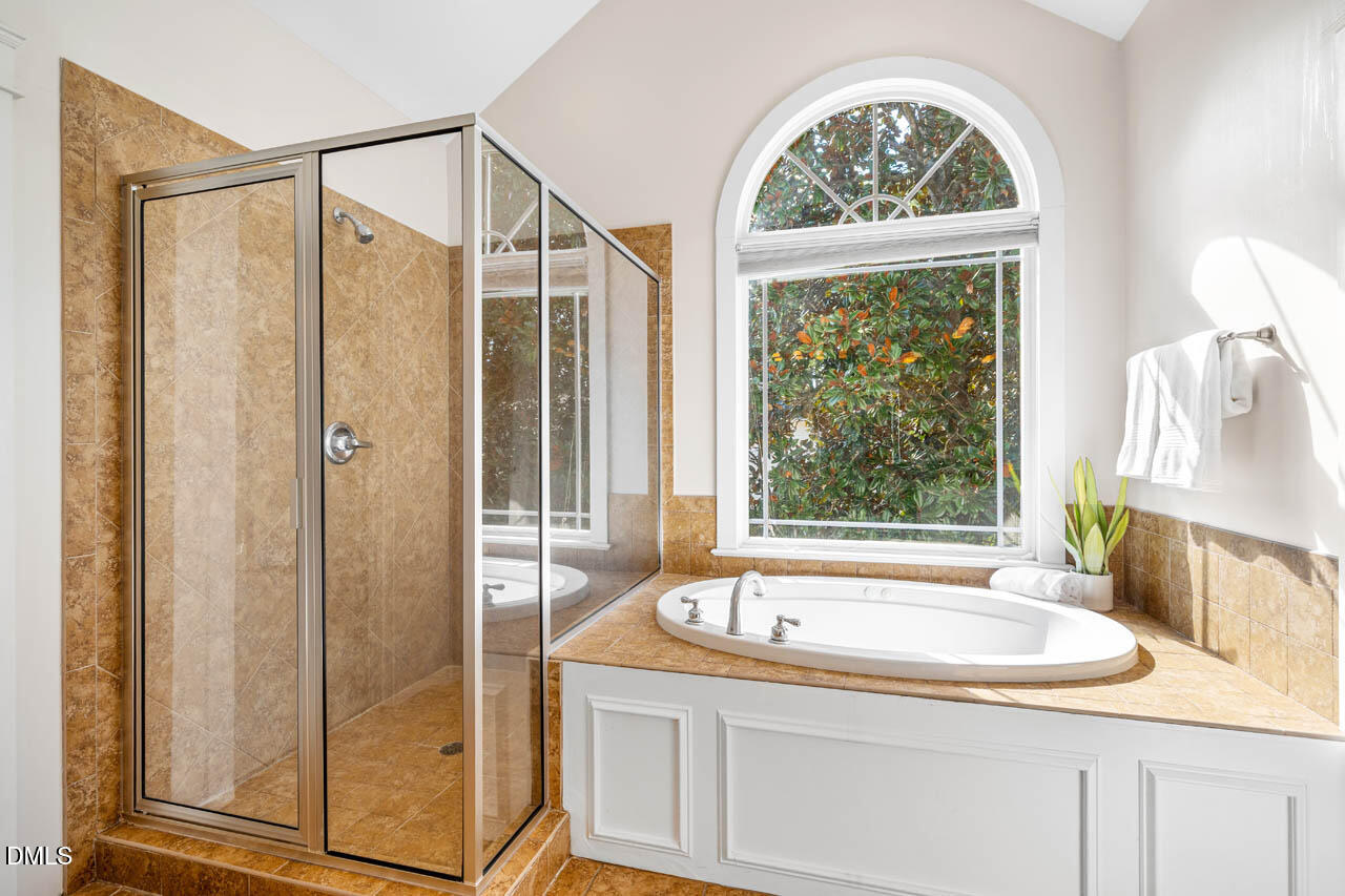 300 Long Meadows Road Chapel Hill, NC 27516 - Photo 23 of 42 a bathroom with a granite countertop sink and a large mirror