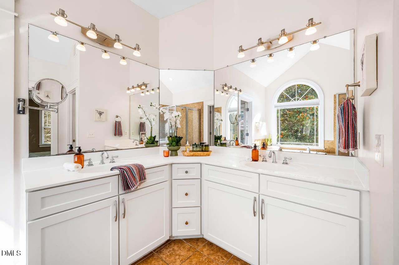 300 Long Meadows Road Chapel Hill, NC 27516 - Photo 24 of 42 a bathroom with a sink a vanity and a mirror