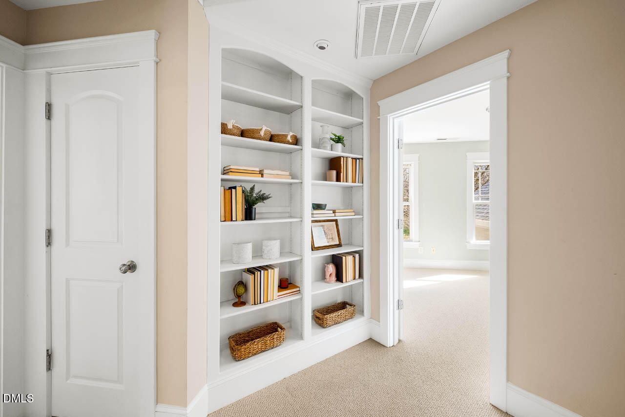 300 Long Meadows Road Chapel Hill, NC 27516 - Photo 26 of 42 a view of a hallway with shelf