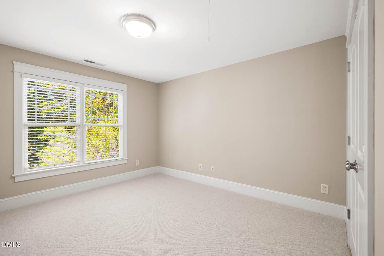 300 Long Meadows Road Chapel Hill, NC 27516 - Photo 27 of 42 an empty room with a window