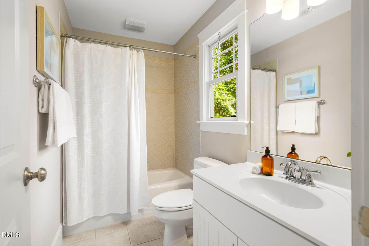 300 Long Meadows Road Chapel Hill, NC 27516 - Photo 28 of 42 a bathroom with a sink toilet and shower