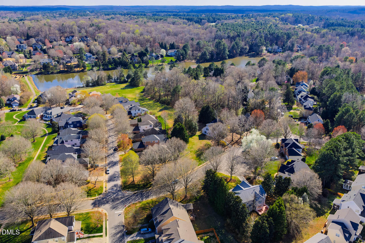 300 Long Meadows Road Chapel Hill, NC 27516 - Photo 38 of 42 an aerial view of lake and residential houses with outdoor space