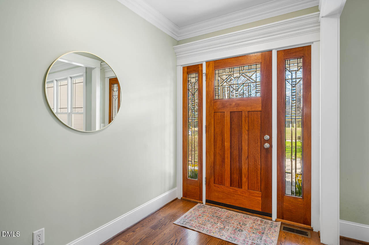 300 Long Meadows Road Chapel Hill, NC 27516 - Photo 8 of 42 a view of a livingroom with wooden floor and a window