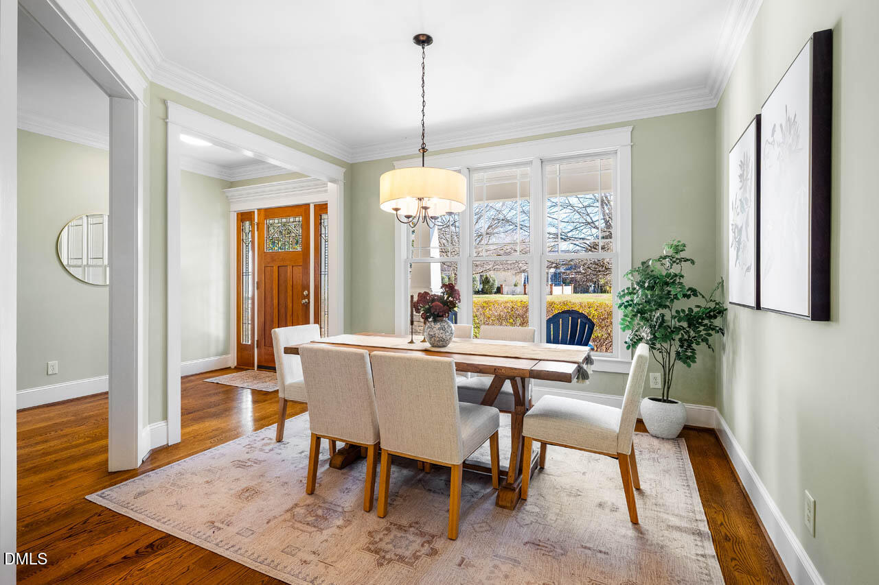 300 Long Meadows Road Chapel Hill, NC 27516 - Photo 9 of 42 a view of a dining room with furniture window and wooden floor