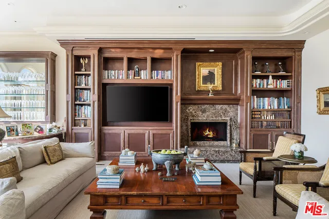 a living room with furniture fireplace and a flat screen tv