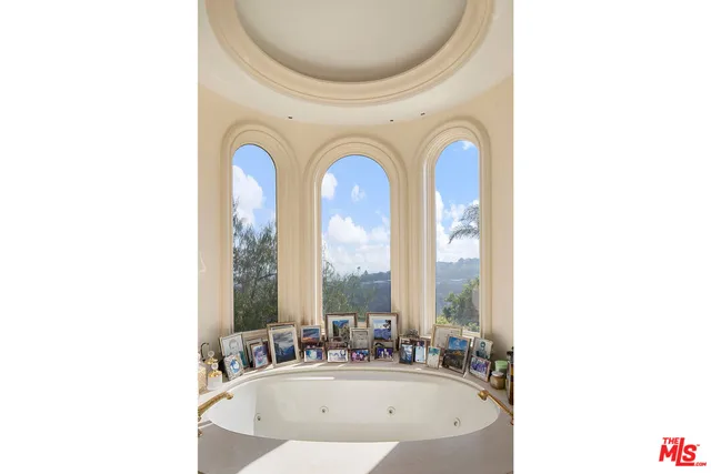 a bathroom with a sink and a large mirror