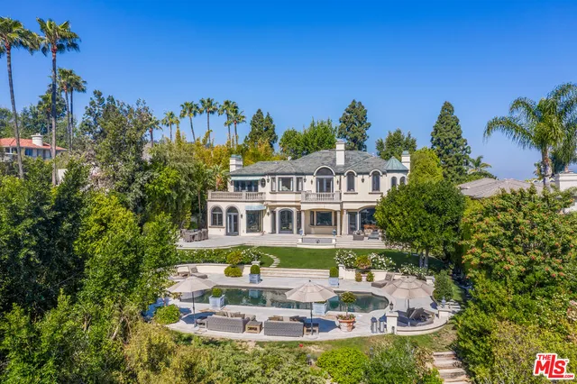 a front view of a house with a swimming pool