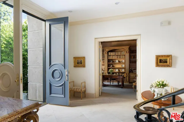 a living room with furniture and natural light