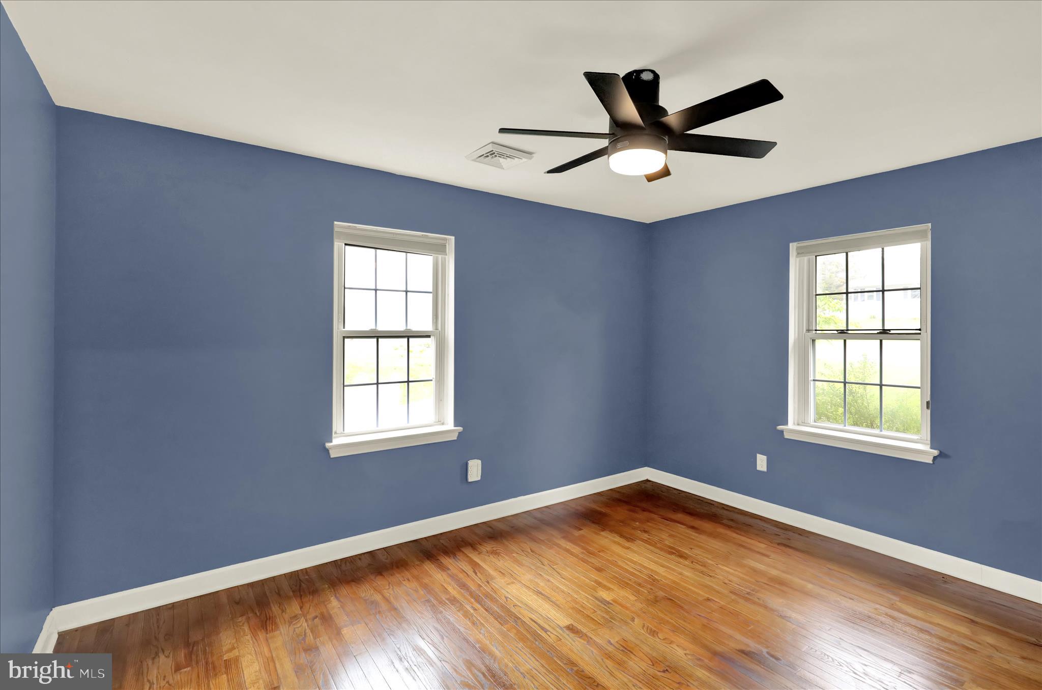 434 East Moyer Road Pottstown, PA 19464 - Photo 22 of 38 an empty room with ceiling fan and windows