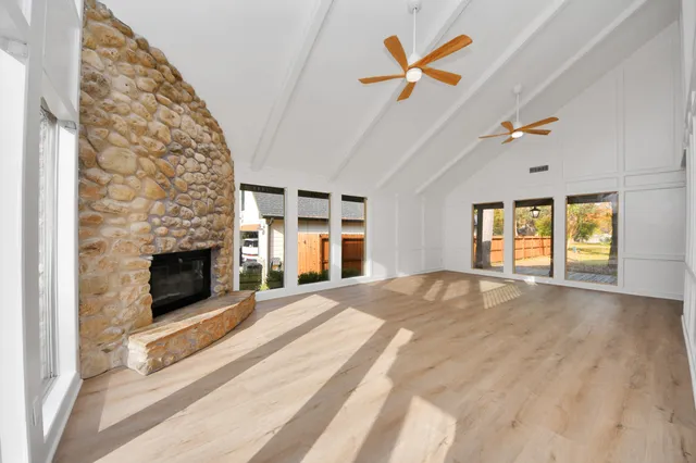 a kitchen with stainless steel appliances a stove sink microwave and cabinets