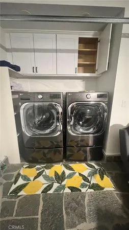 a stove top oven sitting inside of a kitchen